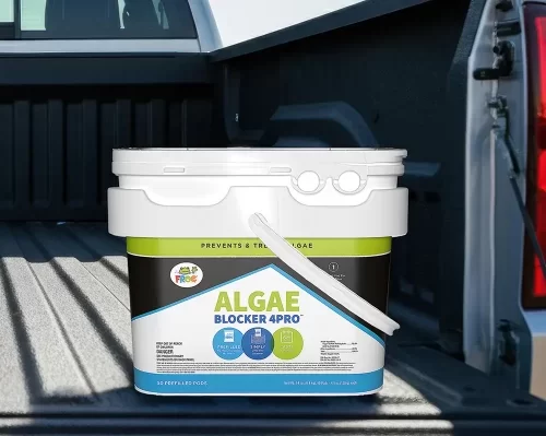 White bucket of Algae Blocker 4PRO sitting on a pickup bed.